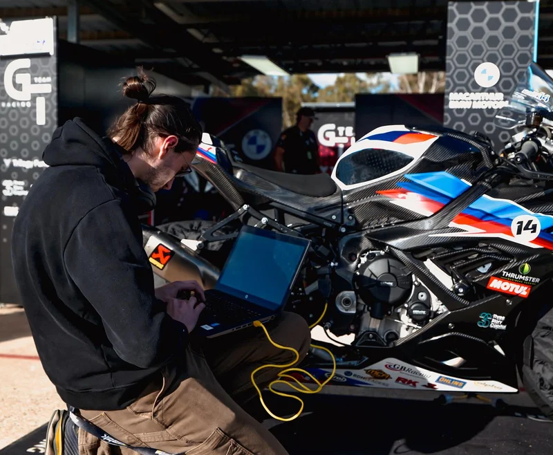 Cody Bower extracting data logs from a BMW M1000RR using Motec datalogging software.